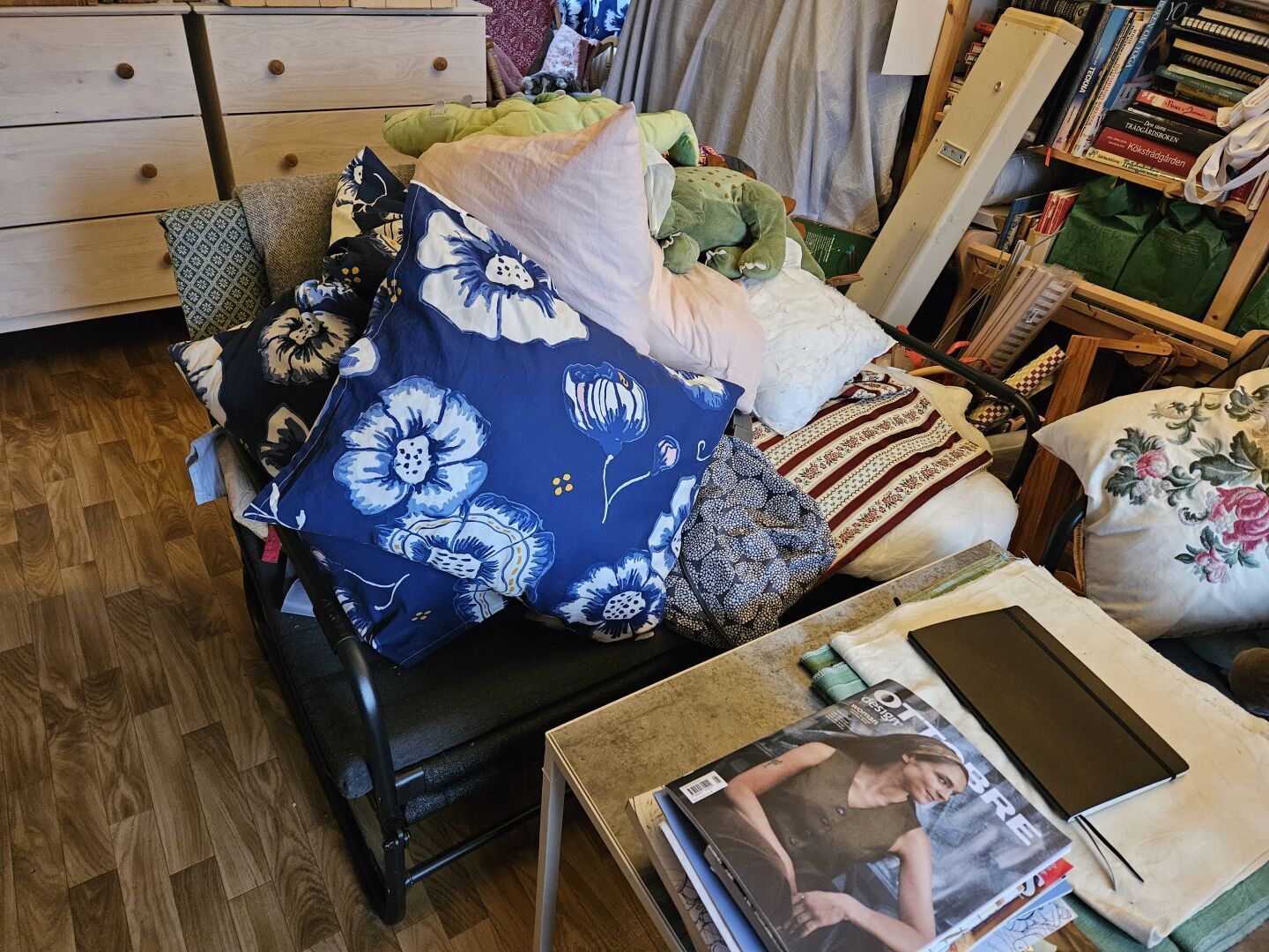 My other couch, filled with cushions, fabric, and plush dinosaurs - looks even more messy.