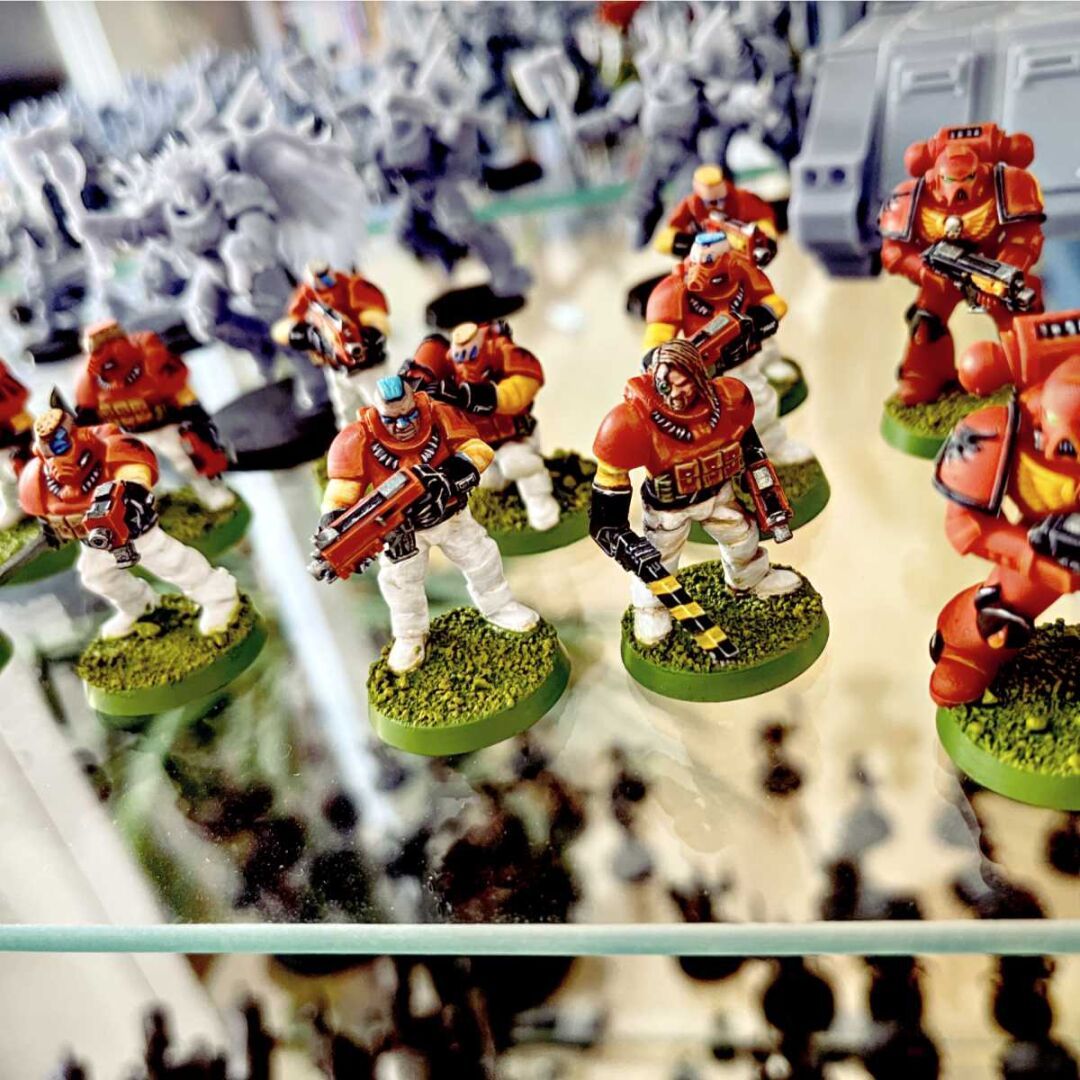 Two squats of Blood Angel Scouts for the Warhammer 40000 miniature game.