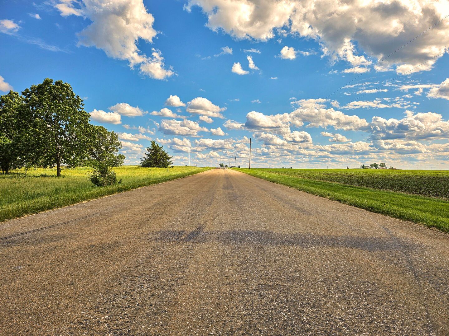 A seemingly endless road under the bright blue sky
