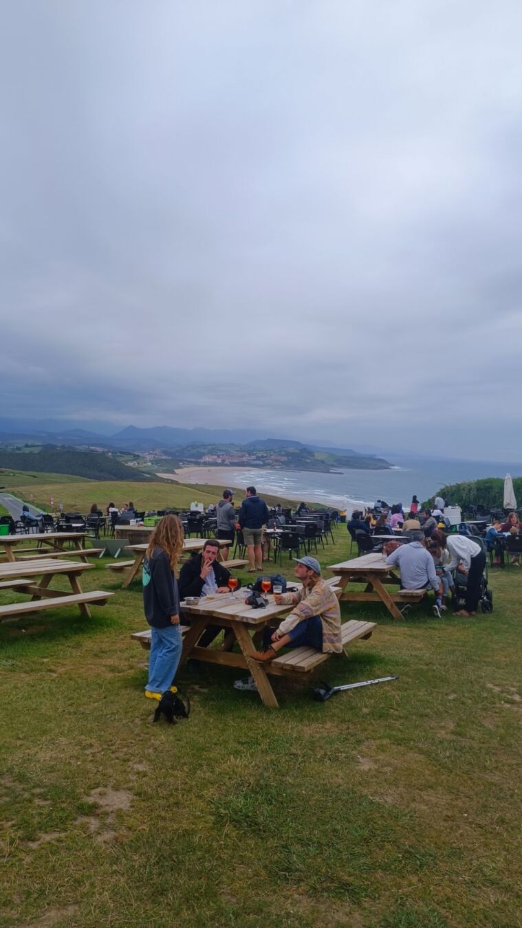 A lawn touching the sea and the sky with happy people somewhere in Spain