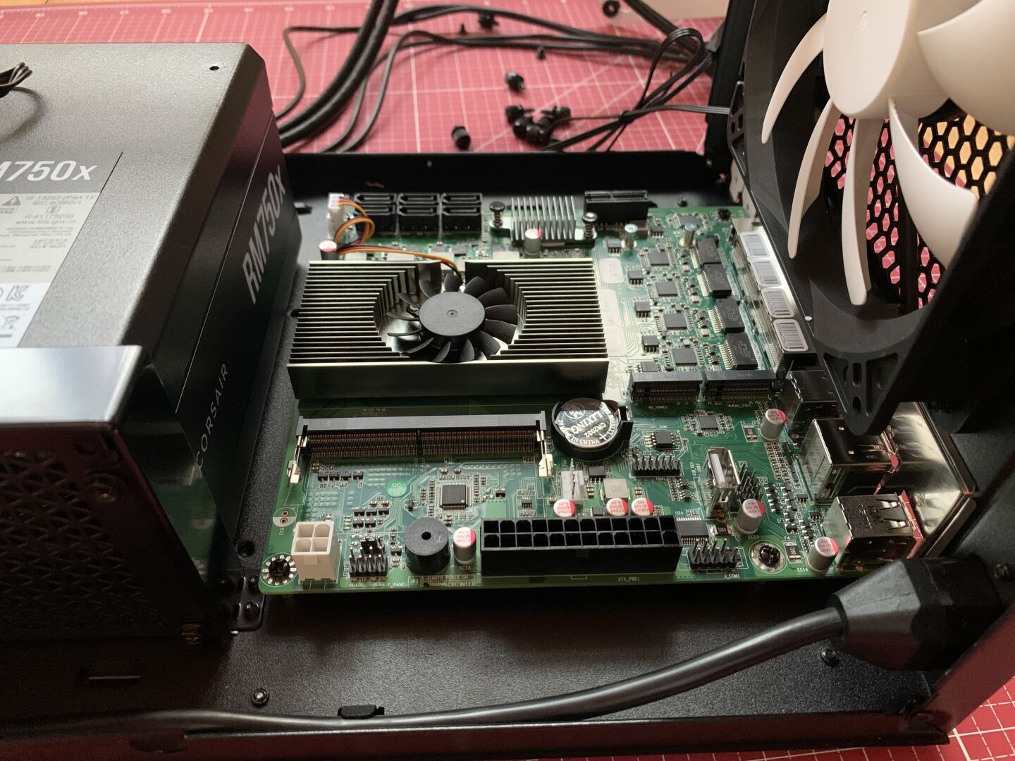 A Mini-atx motherboard mounted into a black NAS computer chasis