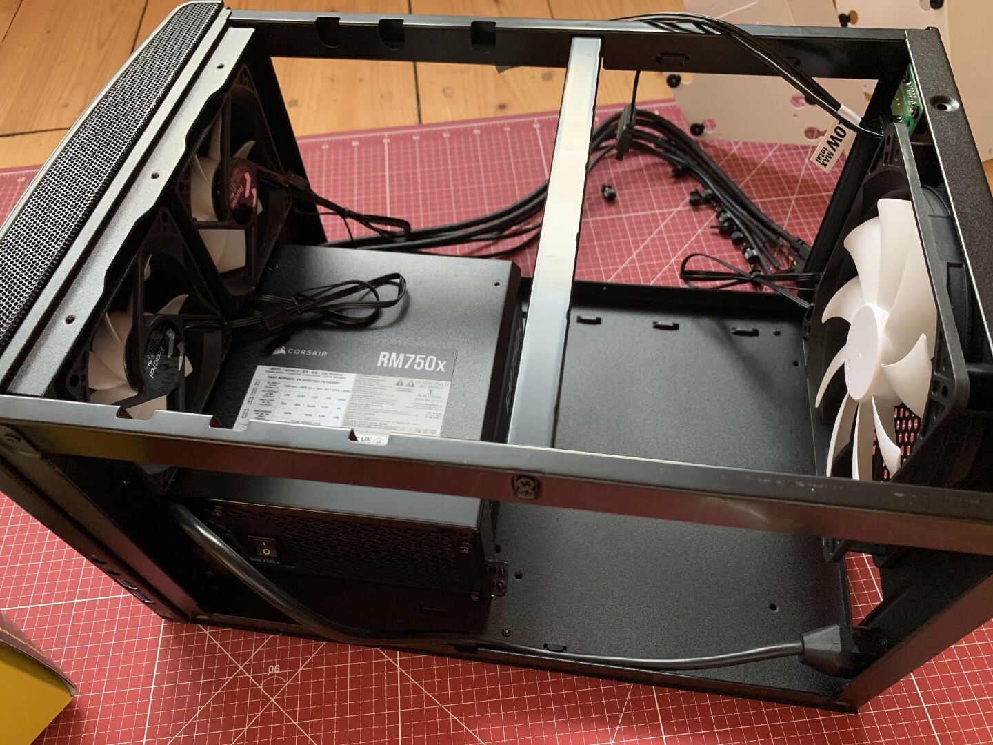 A atx power supply mounted into a black computer chasis