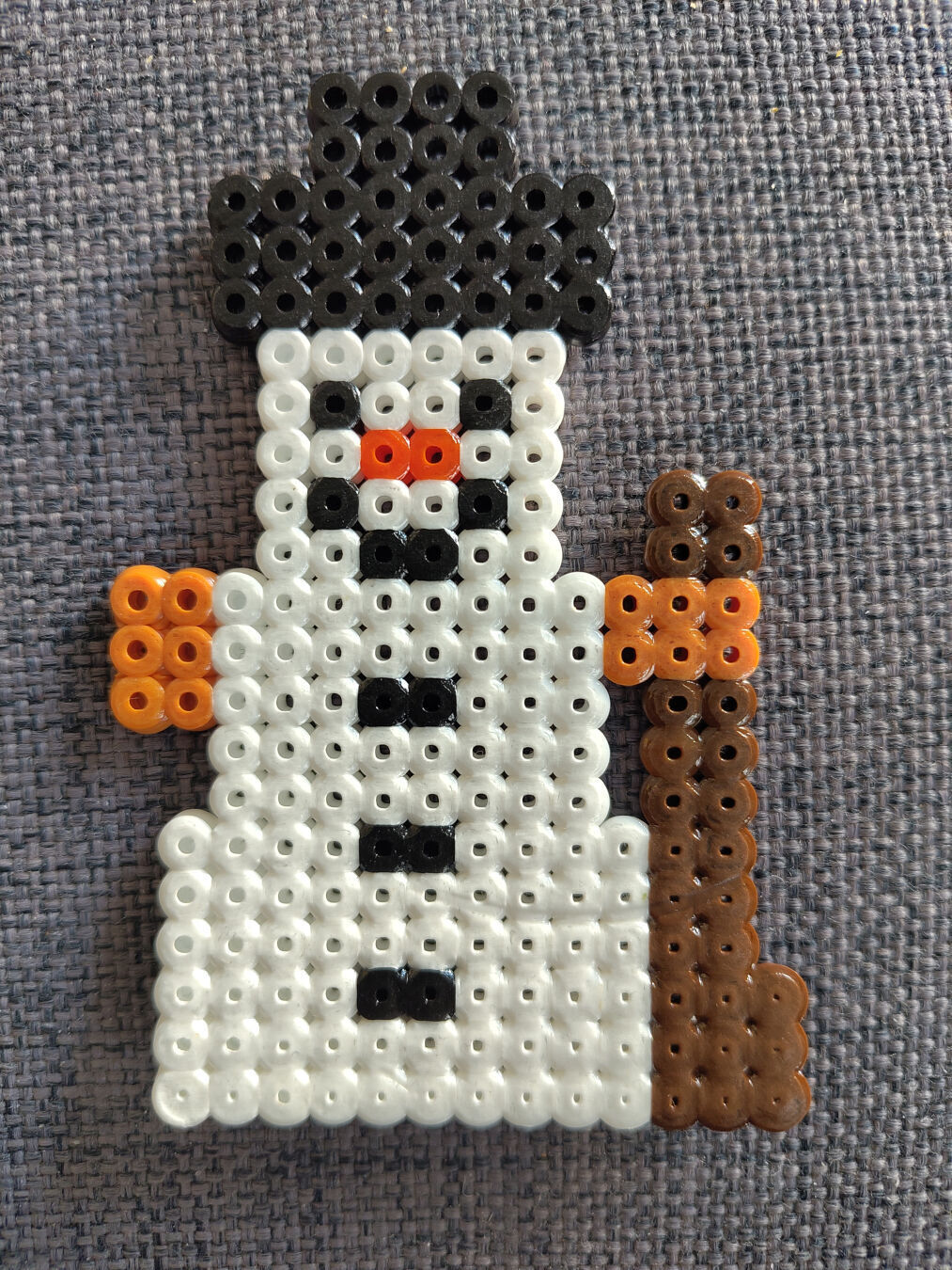 A snowman build from little plastic bits that where melted together.