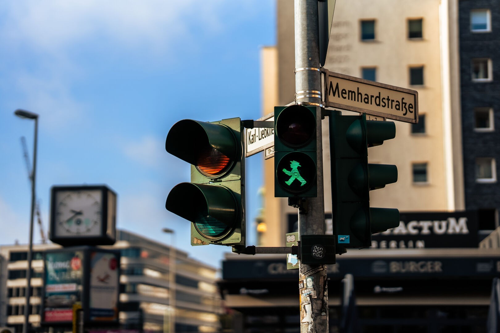 Green pedestrian traffic light with iconic east Berlin "walk" sign