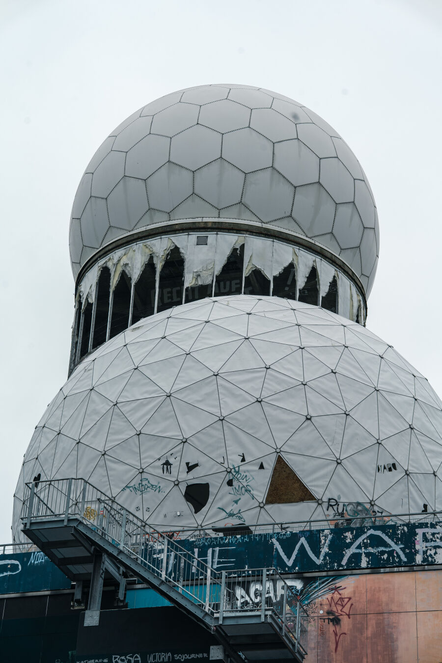 Cupolas of the spy building in a more closeup shot, filling the frame. Clouds in background.