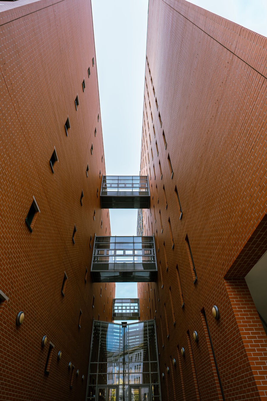 Architecture shot of a building in Berlin. The parallel geometric lines follow towards infinity at the center of the frame.